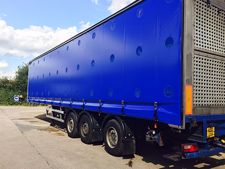 Blue curtainside on lorry trailer